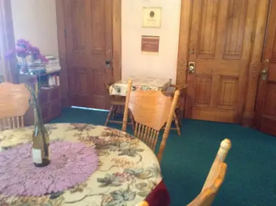a room with a table with a vase on it at Inn Port D'Vino in Dayton