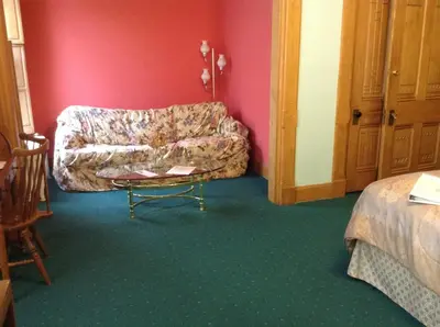 a living room with a couch and a table at Inn Port D'Vino in Dayton