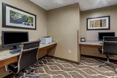 an office with two desks and two computer monitors at Comfort Suites Bridgeport - Clarksburg in Bridgeport