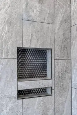 a shower with a grate in a stone wall at 3 Bdrm 3 Full Bath Tower View walk up in Cincinnati