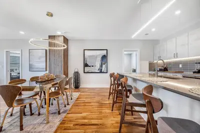 a kitchen and dining room with a table and chairs at 3 Bdrm 3 Full Bath Tower View walk up in Cincinnati