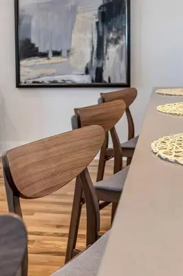 two wooden chairs and a table in a room at 3 Bdrm 3 Full Bath Tower View walk up in Cincinnati