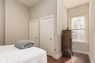 a bedroom with a bed and a dresser and a window at 3-BR Soccer Stadium- Fast Drive to OTR - Downtown in Cincinnati