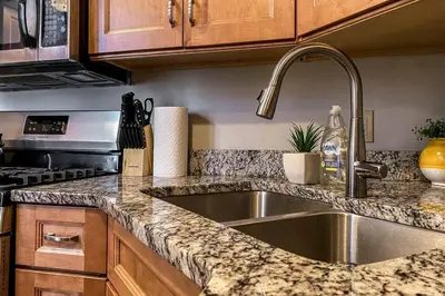 a kitchen with a sink and a counter top at 3-BR Soccer Stadium- Fast Drive to OTR - Downtown in Cincinnati