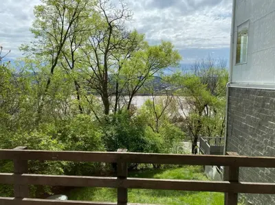 a porch with a fence and a view of the water at Explore Downtown and Mount Adams with River Views in Cincinnati