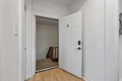 an empty hallway with a white door and a closet at Cozy 2.5BR near Zoo - Hospitals - UC - Free Parking in Cincinnati