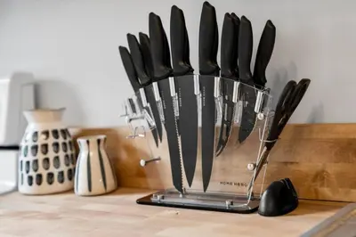 a bunch of knives in a container on a counter at Cozy 2.5BR near Zoo - Hospitals - UC - Free Parking in Cincinnati