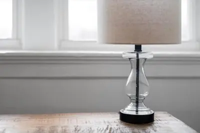 a glass lamp sitting on top of a table at Cozy 2.5BR near Zoo - Hospitals - UC - Free Parking in Cincinnati