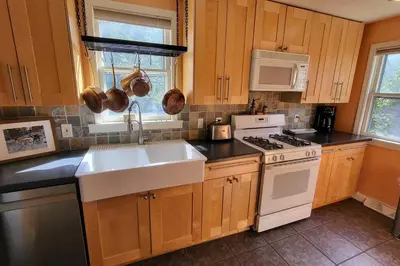a kitchen with a sink and a stove at Cute 3 b 1 b Family home in Cle in Lyndhurst