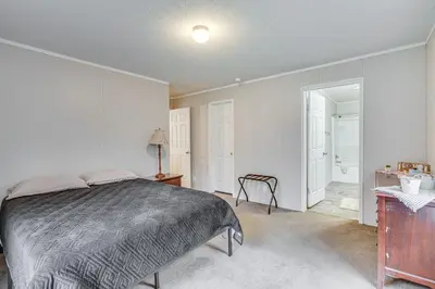 a bedroom with a bed and a bathroom with a sink at Pet-Friendly Home about 10 Mi to Hocking Hills! in South Bloomingville