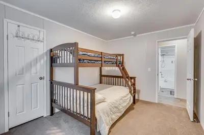 a bedroom with a bunk bed and a closet at Pet-Friendly Home about 10 Mi to Hocking Hills! in South Bloomingville