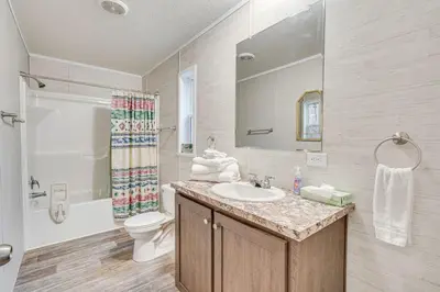 a bathroom with a sink and a toilet and a shower at Pet-Friendly Home about 10 Mi to Hocking Hills! in South Bloomingville