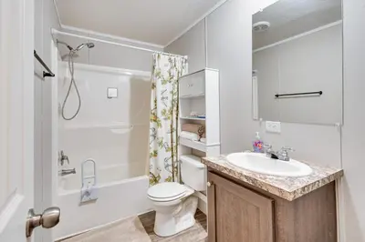 a bathroom with a sink and a toilet and a shower at Pet-Friendly Home about 10 Mi to Hocking Hills! in South Bloomingville