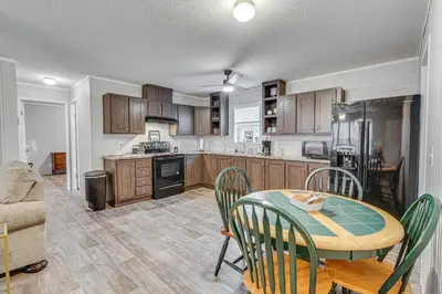 a kitchen and dining room with a table and chairs at Pet-Friendly Home about 10 Mi to Hocking Hills! in South Bloomingville
