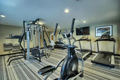 a gym with several tread machines in a room at Candlewood Suites Columbus - Grove City by IHG in Grove City