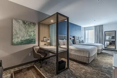 a hotel room with a bed and a desk at SpringHill Suites by Marriott Fort Wayne Southwest in Fort Wayne