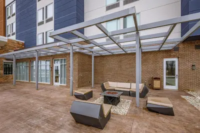 a patio with awning on a brick building at SpringHill Suites by Marriott Fort Wayne Southwest in Fort Wayne