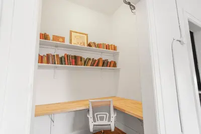 a small room with a table and a chair at Library Square Suites in Toledo