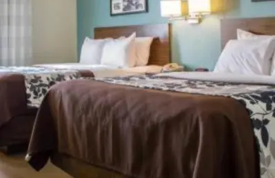 a hotel room with two beds in a room at SureStay by Best Western Cambridge in Cambridge