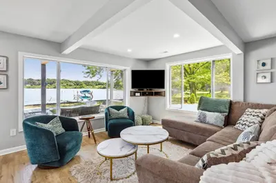 a living room with a couch and chairs at Landmark Lakehouse - luxury living in PLX in Akron