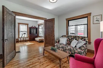 a living room with a couch and a table at Walk to Downtown Kent - 3 BR House w Patio & Yard in Kent