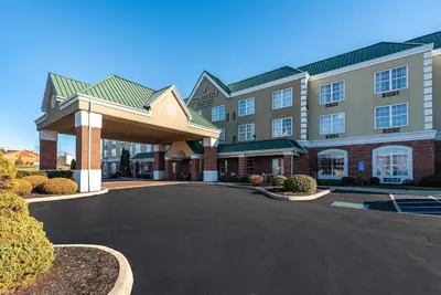a hotel with a parking lot in front of it at Country Inn & Suites by Radisson, Findlay, OH in Findlay
