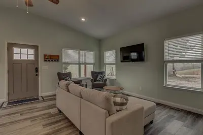 a living room with a couch and a tv at 100 Acre Relaxing Retreat Near ARK - The Cottage in Williamstown