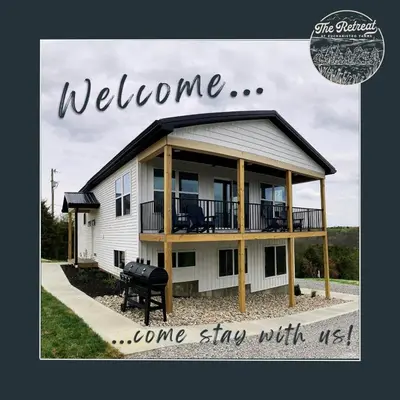 a welcome sign for a home sing with a house at 100 Acre Relaxing Retreat Near ARK- The Farmhouse in Williamstown