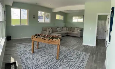 a living room with a table and a couch at 100 Acre Relaxing Retreat Near ARK- The Woodlands in Williamstown