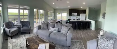 a living room with a couch and a kitchen at 100 Acre Relaxing Retreat Near ARK- The Woodlands in Williamstown