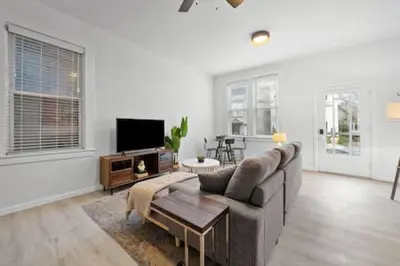a living room with a couch and a table at Charming Mt. Adams 1BR - Near Downtown & Stadiums in Cincinnati
