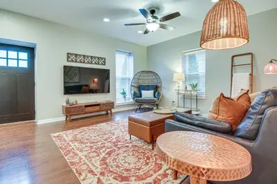 a living room with a couch and a table at Historic Loveland Apt Walk to Little Miami River! in Loveland