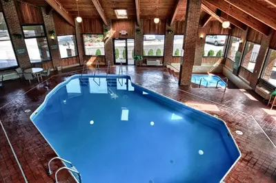 a large indoor swimming pool in a building at Christopher Inn and Suites in Chillicothe
