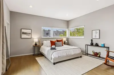 a bedroom with a bed and two windows at Luxuary Tremont Home - Movie Room, Pet & Baby Friendly in Cleveland