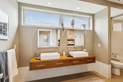 two sinks in a bathroom with a window at Luxuary Tremont Home - Movie Room, Pet & Baby Friendly in Cleveland