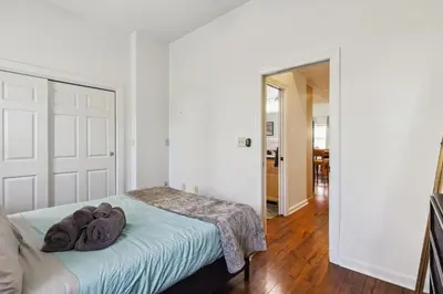 a bedroom with a bed with two towels on it at Newly Renovated Tremont Treasure I Cozy + Modern in Cleveland