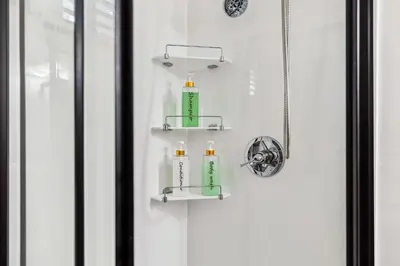 a bathroom door with two soap bottles on a shelf at Newly Renovated Tremont Treasure I Cozy + Modern in Cleveland