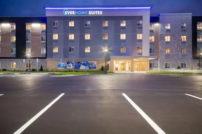 an empty parking lot in front of a hotel at Everhome Suites Lexington - Horse Park in Lexington
