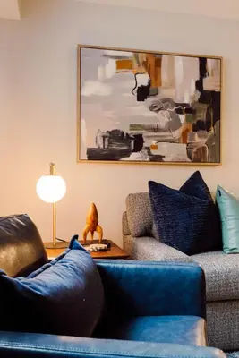 a living room with a couch and a table at Maple Heights Haven - Unit 4 in Maple Heights