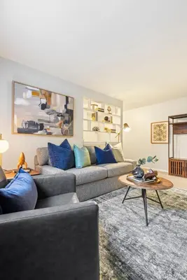 a living room with a couch and a table at Maple Heights Haven - Unit 4 in Maple Heights