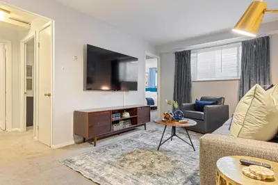 a living room with a couch and a tv at Maple Heights Haven - Unit 4 in Maple Heights