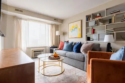 a living room with a couch and a table at Maple Heights Bliss - Unit 12 in Maple Heights