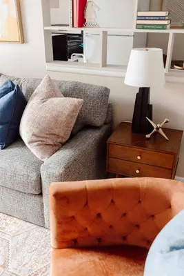 a living room with a couch and a table with a lamp at Maple Heights Bliss - Unit 12 in Maple Heights