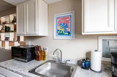a kitchen with a sink and a microwave at Maple Heights Bliss - Unit 12 in Maple Heights
