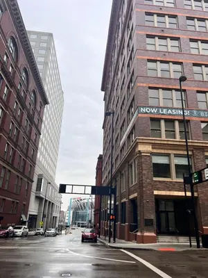 a city street with a traffic light and buildings at King Bed, Downtown Steps from Bengals & Reds, Minutes to OTR, TQL, HardRock in Cincinnati