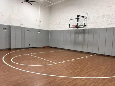a basketball court with a hoop in a gym at King Bed, Downtown Steps from Bengals & Reds, Minutes to OTR, TQL, HardRock in Cincinnati
