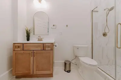 a bathroom with a toilet and a sink and a shower at East Main Lofts - Minimalist 302 in Madison