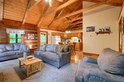 a living room with two couches and a table at Chickasaw in Logan