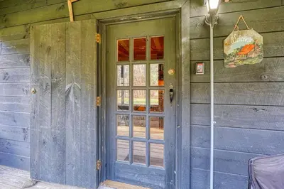 an open door of a house with a blue door at Bison Hollow Hideaway in South Bloomingville