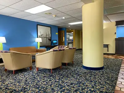 a waiting room with couches and chairs in a hospital at Super 8 by Wyndham Port Clinton in Port Clinton